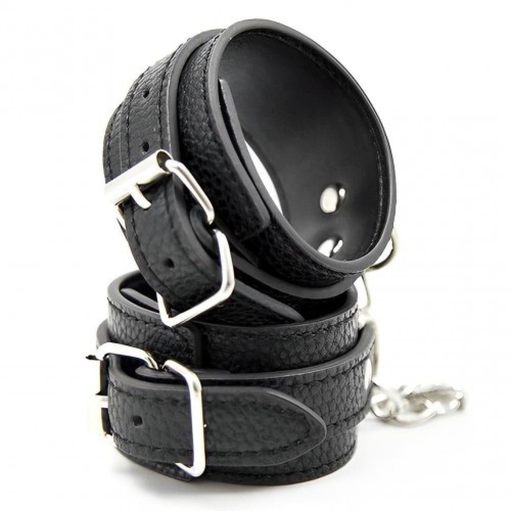Наручники из экокожи DS Fetish Wrist Restraints чорні із сріблястою фурнітурою
