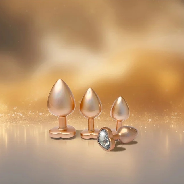 Набор из трёх анальных пробок Dream Toys Gleaming Love, размеры S, M, L, перламутрово-золотые